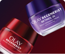 Red glass jar of Olay Micro-Sculpting Cream Moisturizer tilted on the bottom left with a purple glass jar of Olay Retinol24 Night Face Moisturizer tilted on the top right floating above it